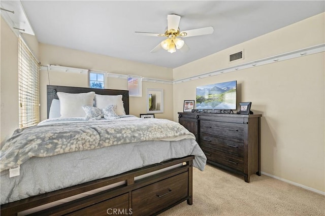 28436 Calex Dr, Valencia, CA 91354 - bedroom featuring light colored carpet, baseboards, multiple windows, and ceiling fan