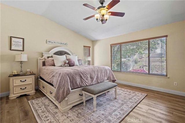 28436 Calex Dr, Valencia, CA 91354 - bedroom featuring vaulted ceiling, wood finished floors, baseboards, and ceiling fan
