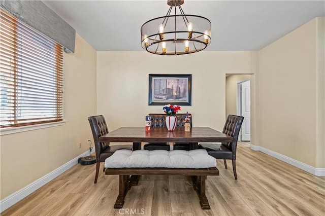 28436 Calex Dr, Valencia, CA 91354 - dining area featuring a chandelier, light wood finished floors, and baseboards
