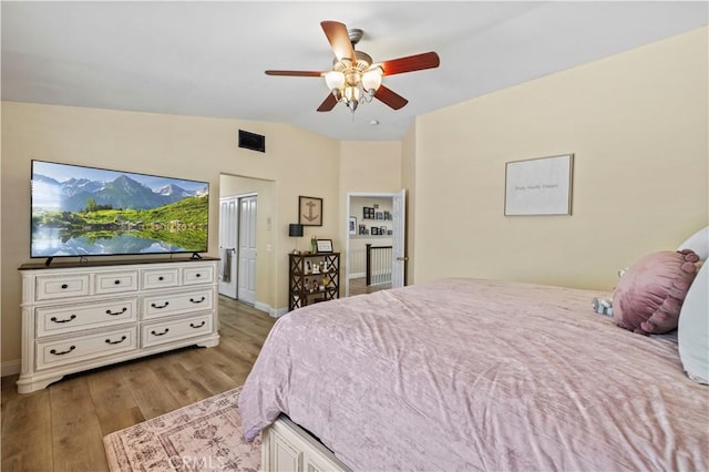28436 Calex Dr, Valencia, CA 91354 - bedroom with light wood-type flooring, lofted ceiling, baseboards, and ceiling fan
