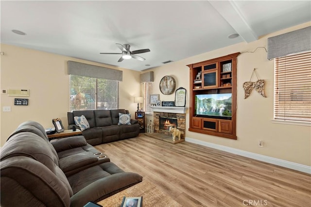 28436 Calex Dr, Valencia, CA 91354 - living area with a ceiling fan, light wood-style floors, a fireplace, beamed ceiling, and baseboards