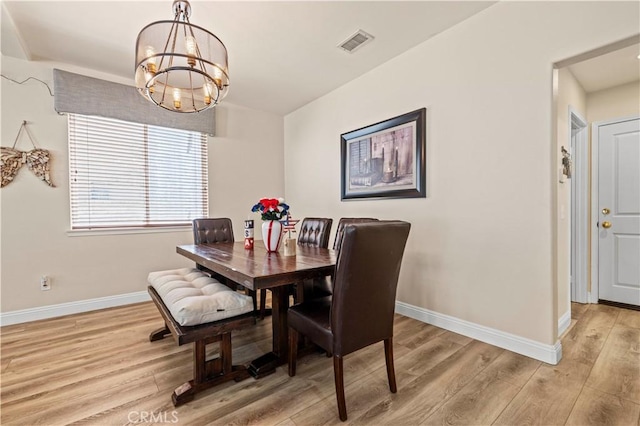 28436 Calex Dr, Valencia, CA 91354 - dining space featuring a chandelier, baseboards, and light wood-style floors
