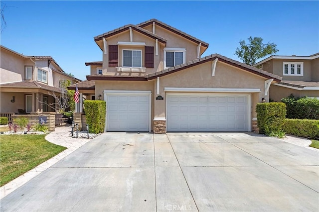28436 Calex Dr, Valencia, CA 91354 - view of front facade with stucco siding, concrete driveway, a tiled roof, stone siding, and an attached garage