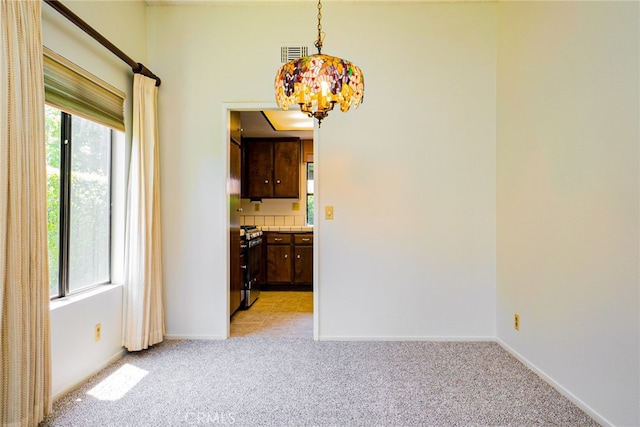 751 Santa Fe Ct, San Dimas, CA 91773 - unfurnished dining area featuring a chandelier, light carpet, and healthy amount of natural light