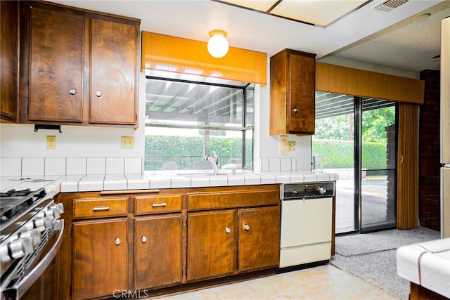 751 Santa Fe Ct, San Dimas, CA 91773 - kitchen with healthy amount of natural light, stainless steel gas stove, and a sink