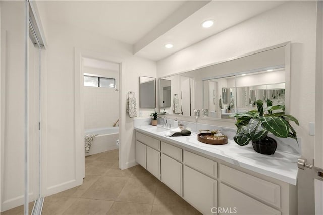 5622 Revere Ave, Rancho Cucamonga, CA 91737 - bathroom featuring double vanity, a bathtub, tile patterned flooring, and recessed lighting