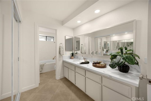 5622 Revere Ave, Rancho Cucamonga, CA 91737 - bathroom featuring double vanity, a bath, tile patterned floors, and recessed lighting