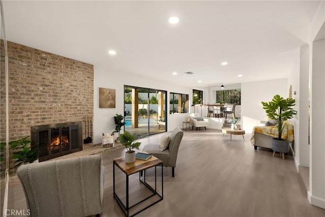 5622 Revere Ave, Rancho Cucamonga, CA 91737 - living room with wood finished floors, recessed lighting, and a fireplace