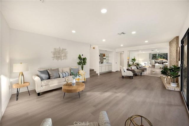 5622 Revere Ave, Rancho Cucamonga, CA 91737 - living room featuring wood finished floors, recessed lighting, and stairway