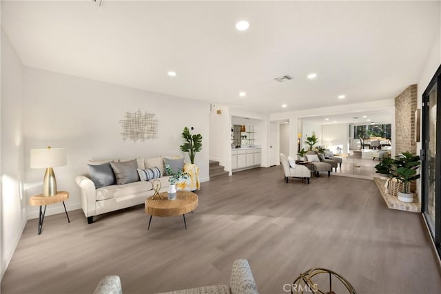 5622 Revere Ave, Rancho Cucamonga, CA 91737 - living room featuring wood finished floors, recessed lighting, and stairway