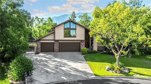 5622 Revere Ave, Rancho Cucamonga, CA 91737 - mid-century home with stucco siding, driveway, a mountain view, an attached garage, and brick siding