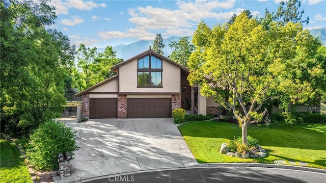 5622 Revere Ave, Rancho Cucamonga, CA 91737 - view of front facade with stucco siding, a front lawn, driveway, a garage, and brick siding