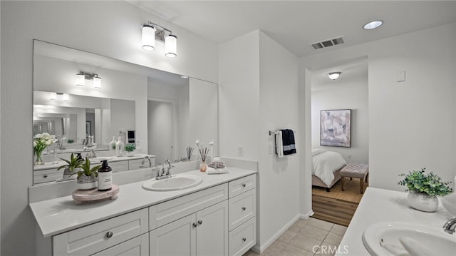 410 W Main St Unit 231, Alhambra, CA 91801 - ensuite bathroom featuring two vanities, tile patterned floors, and baseboards