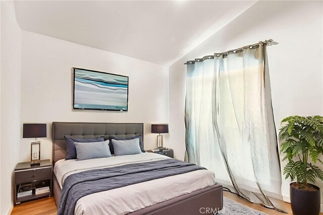 1784 Promenade Pl, Vista, CA 92083 - bedroom with lofted ceiling and wood finished floors