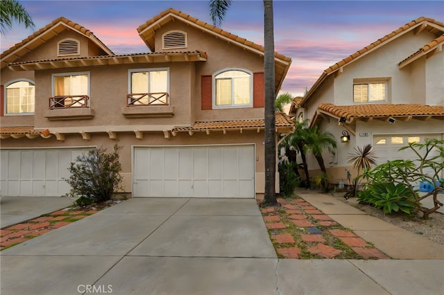 1784 Promenade Pl, Vista, CA 92083 - mediterranean / spanish-style house with a garage, stucco siding, concrete driveway, and a tile roof