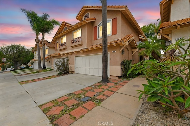 1784 Promenade Pl, Vista, CA 92083 - view of front of home with a tiled roof, stucco siding, and a garage