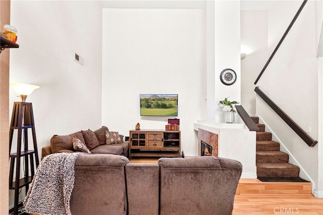 1784 Promenade Pl, Vista, CA 92083 - living area with light wood-style floors, stairway, and a high end fireplace