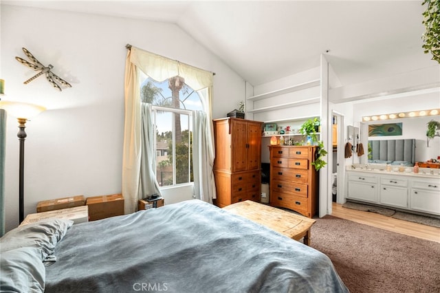 1784 Promenade Pl, Vista, CA 92083 - bedroom with vaulted ceiling, light wood-style flooring, and ensuite bathroom