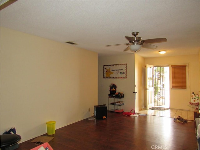 26250 Spaniel Ln, Menifee, CA 92586 - living room featuring wood finished floors, a ceiling fan, and baseboards