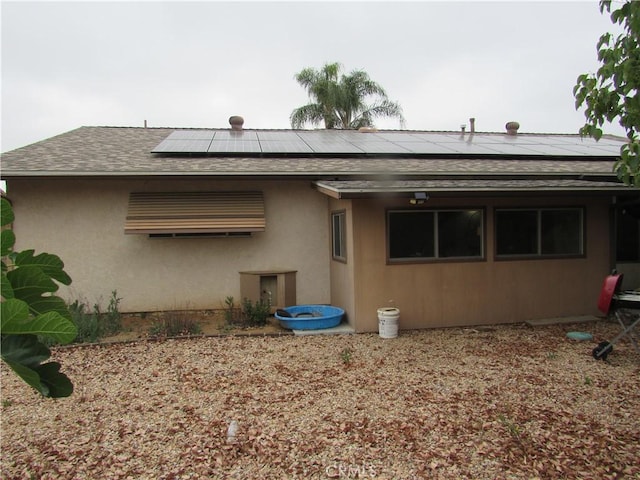 26250 Spaniel Ln, Menifee, CA 92586 - back of house with roof with shingles and solar panels