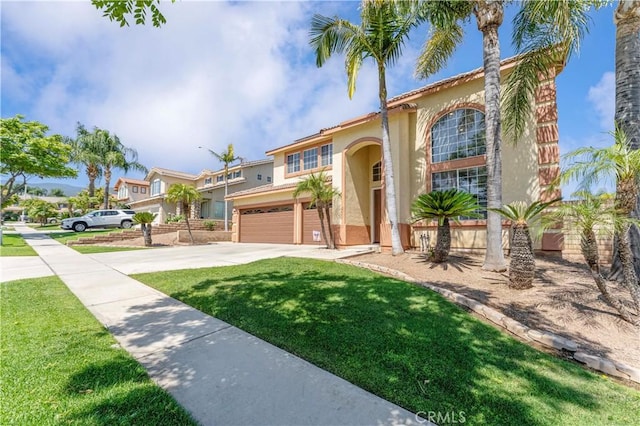 3582 Cedar Ridge Ln, Corona, CA 92881 - mediterranean / spanish-style home with an attached garage, stucco siding, driveway, and a front yard