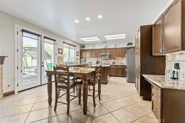 3582 Cedar Ridge Ln, Corona, CA 92881 - dining space featuring light tile patterned floors and recessed lighting