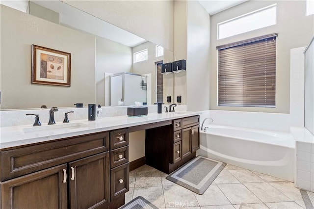 3582 Cedar Ridge Ln, Corona, CA 92881 - bathroom featuring healthy amount of natural light, a bath, double vanity, a shower stall, and a towering ceiling