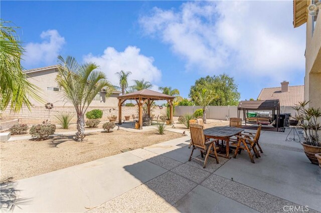 3582 Cedar Ridge Ln, Corona, CA 92881 - fenced backyard featuring a gazebo, outdoor dining area, and a patio area