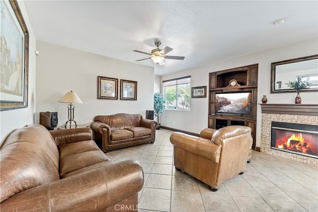 3582 Cedar Ridge Ln, Corona, CA 92881 - living room with ceiling fan, light tile patterned flooring, a fireplace, and baseboards