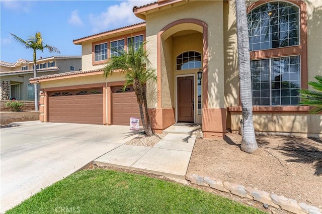 3582 Cedar Ridge Ln, Corona, CA 92881 - doorway to property featuring stucco siding, concrete driveway, an attached garage, and a tile roof