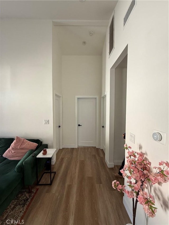 18649 Willard St, Reseda, CA 91335 - corridor with a towering ceiling, wood finished floors, and baseboards