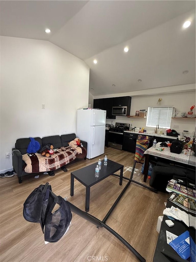 18649 Willard St, Reseda, CA 91335 - living room featuring light wood-type flooring, lofted ceiling, and recessed lighting