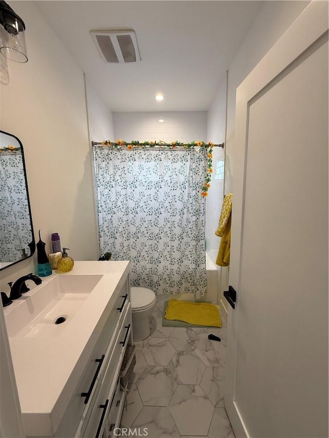 18649 Willard St, Reseda, CA 91335 - full bathroom featuring vanity, marble look tiles, shower / bath combo, recessed lighting, and toilet