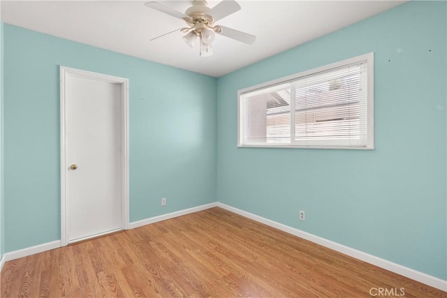 20632 Egret Ln, Huntington Beach, CA 92646 - unfurnished room with wood finished floors, ceiling fan, and baseboards