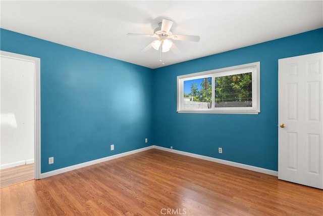 20632 Egret Ln, Huntington Beach, CA 92646 - spare room with wood finished floors, ceiling fan, and baseboards