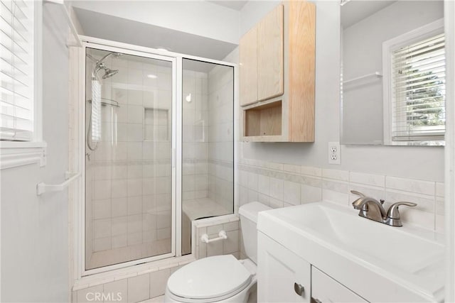 20632 Egret Ln, Huntington Beach, CA 92646 - bathroom featuring toilet, tile walls, a stall shower, and vanity