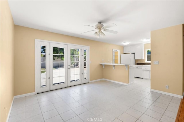 20632 Egret Ln, Huntington Beach, CA 92646 - doorway with french doors, ceiling fan, healthy amount of natural light, and baseboards