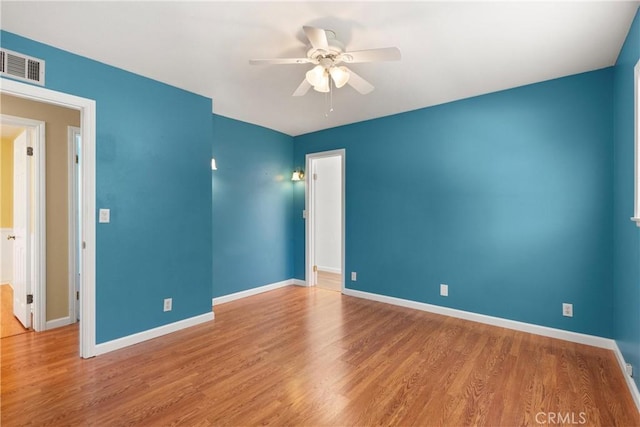 20632 Egret Ln, Huntington Beach, CA 92646 - empty room with a ceiling fan, wood finished floors, and baseboards
