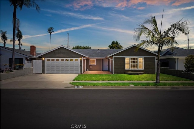 20632 Egret Ln, Huntington Beach, CA 92646 - ranch-style house with an attached garage and driveway