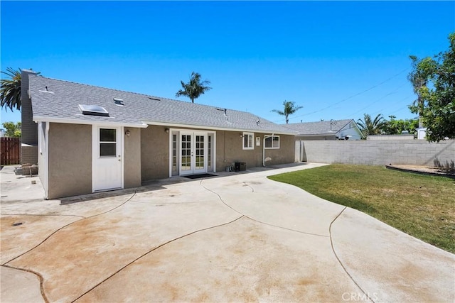 20632 Egret Ln, Huntington Beach, CA 92646 - back of house with french doors, stucco siding, a patio area, and a shingled roof