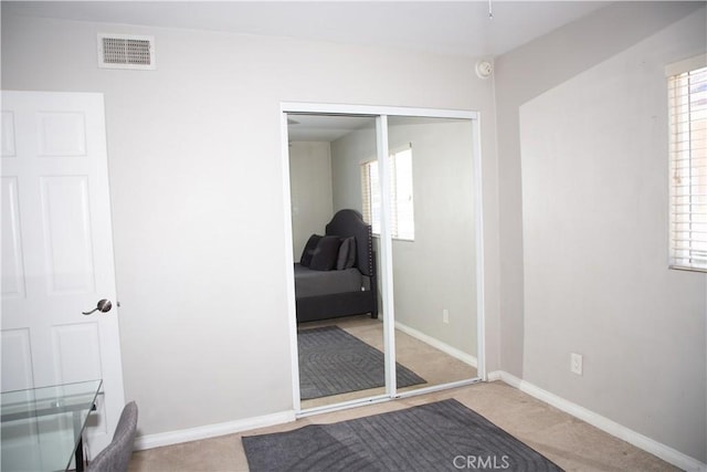 17471 Reed St, Fontana, CA 92336 - bedroom with multiple windows, baseboards, a closet, and carpet flooring