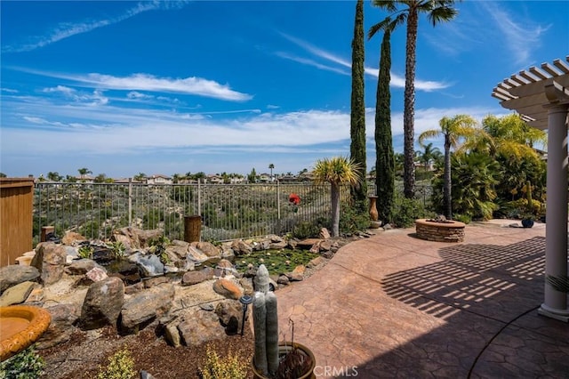 33850 Sattui St, Temecula, CA 92592 - view of patio / terrace with an outdoor fire pit