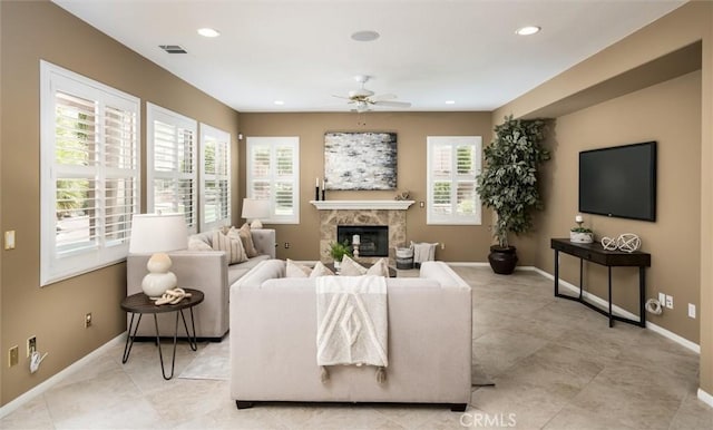 33850 Sattui St, Temecula, CA 92592 - living room with baseboards, a ceiling fan, a glass covered fireplace, and recessed lighting