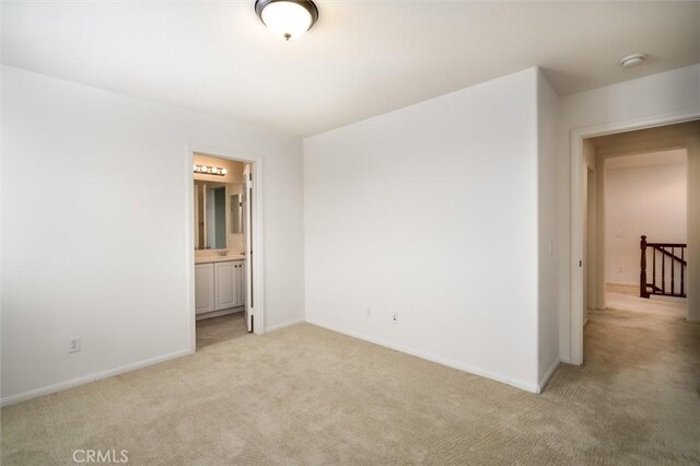 33850 Sattui St, Temecula, CA 92592 - unfurnished room featuring light colored carpet, baseboards, and a smoke detector