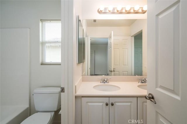 33850 Sattui St, Temecula, CA 92592 - bathroom featuring toilet, double vanity, and shower / bathtub combination