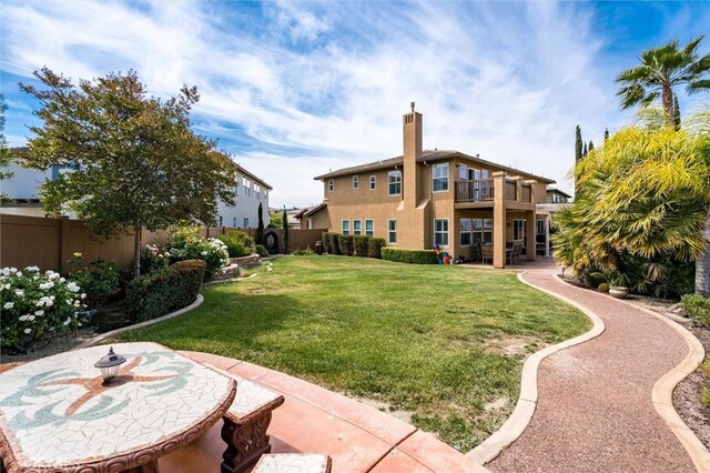 33850 Sattui St, Temecula, CA 92592 - view of yard featuring a balcony and a patio