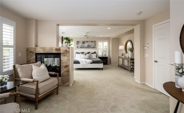 33850 Sattui St, Temecula, CA 92592 - living room featuring light carpet, a multi sided fireplace, recessed lighting, and a ceiling fan