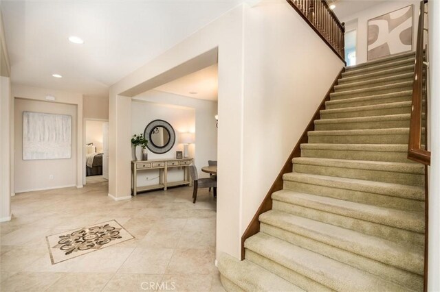 33850 Sattui St, Temecula, CA 92592 - staircase with recessed lighting, tile patterned flooring, and baseboards