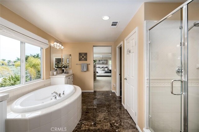 33850 Sattui St, Temecula, CA 92592 - bathroom featuring vanity, a bath, a stall shower, marble finish flooring, and baseboards