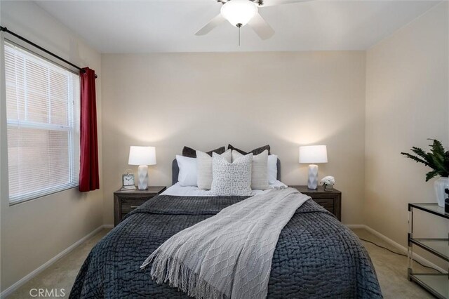 33850 Sattui St, Temecula, CA 92592 - bedroom with light carpet, baseboards, and ceiling fan
